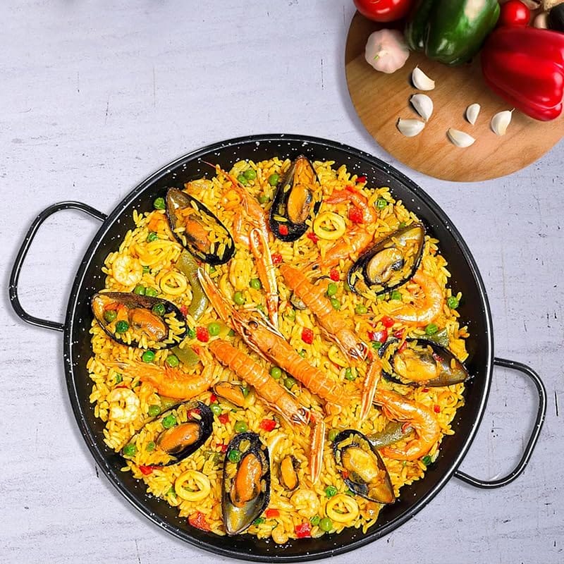 padella paella smaltata nera da 38 cm con manici e paella valenciana con frutti di mare e verdure