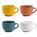 Set 4 tazze da latte in porcellana colorate Set di quattro tazze da latte in porcellana nei colori giallo, terracotta, blu petrolio e bianco