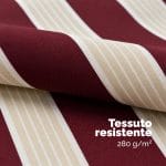 Telo rigato bordeaux e beige per tenda da sole impermeabile Dettaglio del telo rigato bordeaux e beige da esterno con trama resistente per tenda da sole schermante