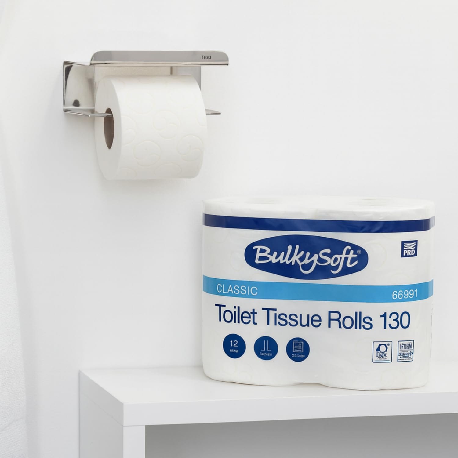 Rotolo carta igienica su porta rotolo in metallo con ripiano multifunzione