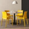 Set 4 sedie gialle Grandsoleil Venice in plastica impilabili abbinate a tavolo rotondo design
