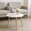Tavolino basso rotondo in legno con piano bianco, ideale per salotto moderno